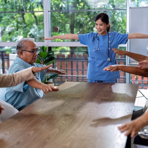 At home care service nurse caregiver take the lead to elderly person exercise in every morning